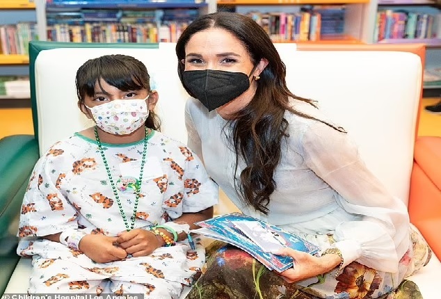 "storytime session at Children'" "she excitedly reads to kids during"